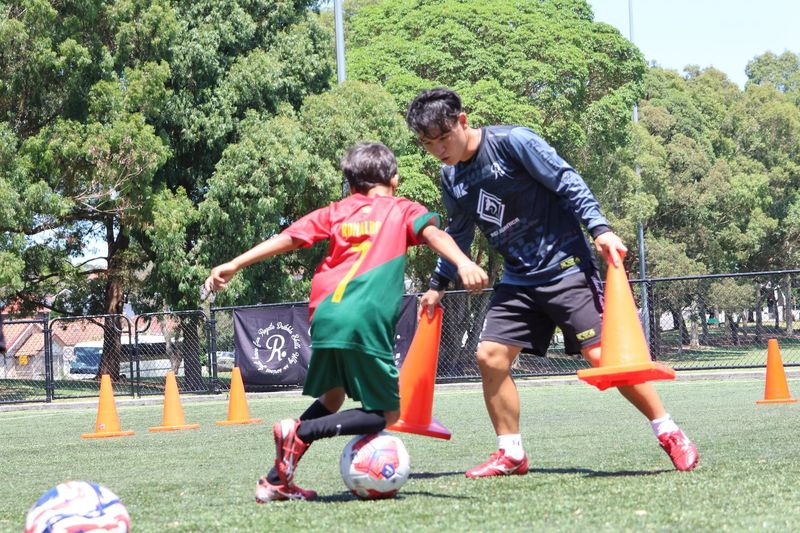At Kei Dribble Academy, our trained coaches guide young athletes through essential skills like ball mastery and dribbling techniques to enhance their game confidence.