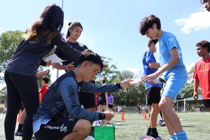 Participants engage in skill-building activities focusing on dribbling and ball mastery at the Kei Dribble Academy in Sydney.