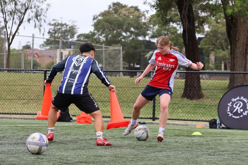 Participants engage in skill-building exercises focusing on dribbling and ball control. This session enhances decision-making and confidence on the field.